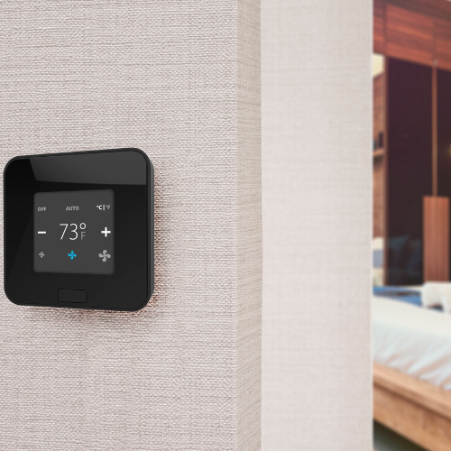 Detailed view of the minimalist design of the EOS thermostat, integrating seamlessly with modern hotel decor